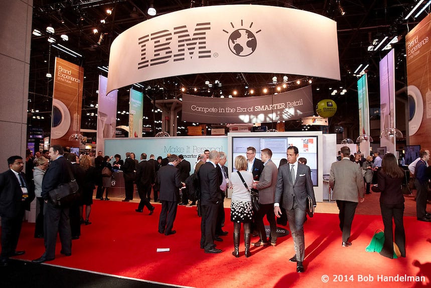 Crowds filling the IBM booth on the red carpet under the IBM sign