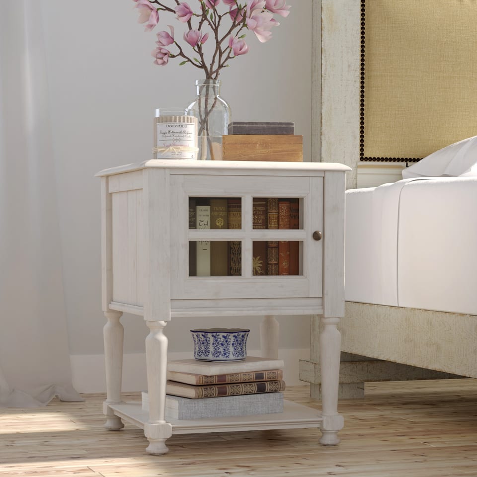 3D rendering of a white nightstand with flowers beside a bed