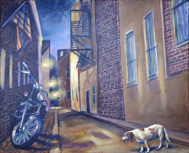 Lyla-belle the beagle in a dark city alley beside a parked motorcycle at midnight